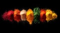 A dazzling assortment of colorful spices forms a horizontal line against a black background.